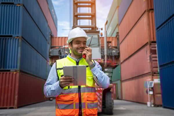 male-container-yard-worker-control-and-checking-co-2024-12-12-23-25-29-utc