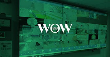 Video wall displaying live camera footage in security operations control room in Portugal's World of Wine managed by Userful's platform with green overlay and logo